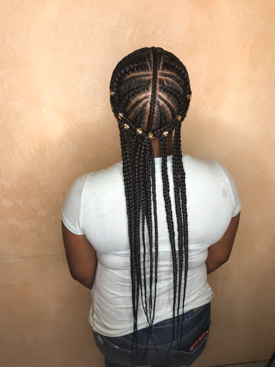 Fulani-inspired braids with gold beads