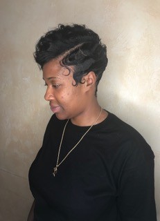 Sculpted black pin curls, side view